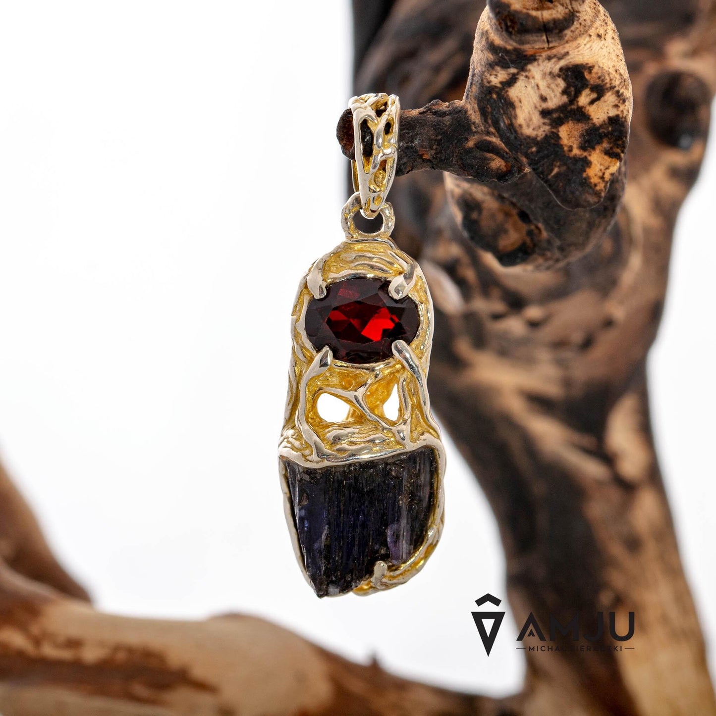 Raw Tanzanite crystal with oval cut Garnet