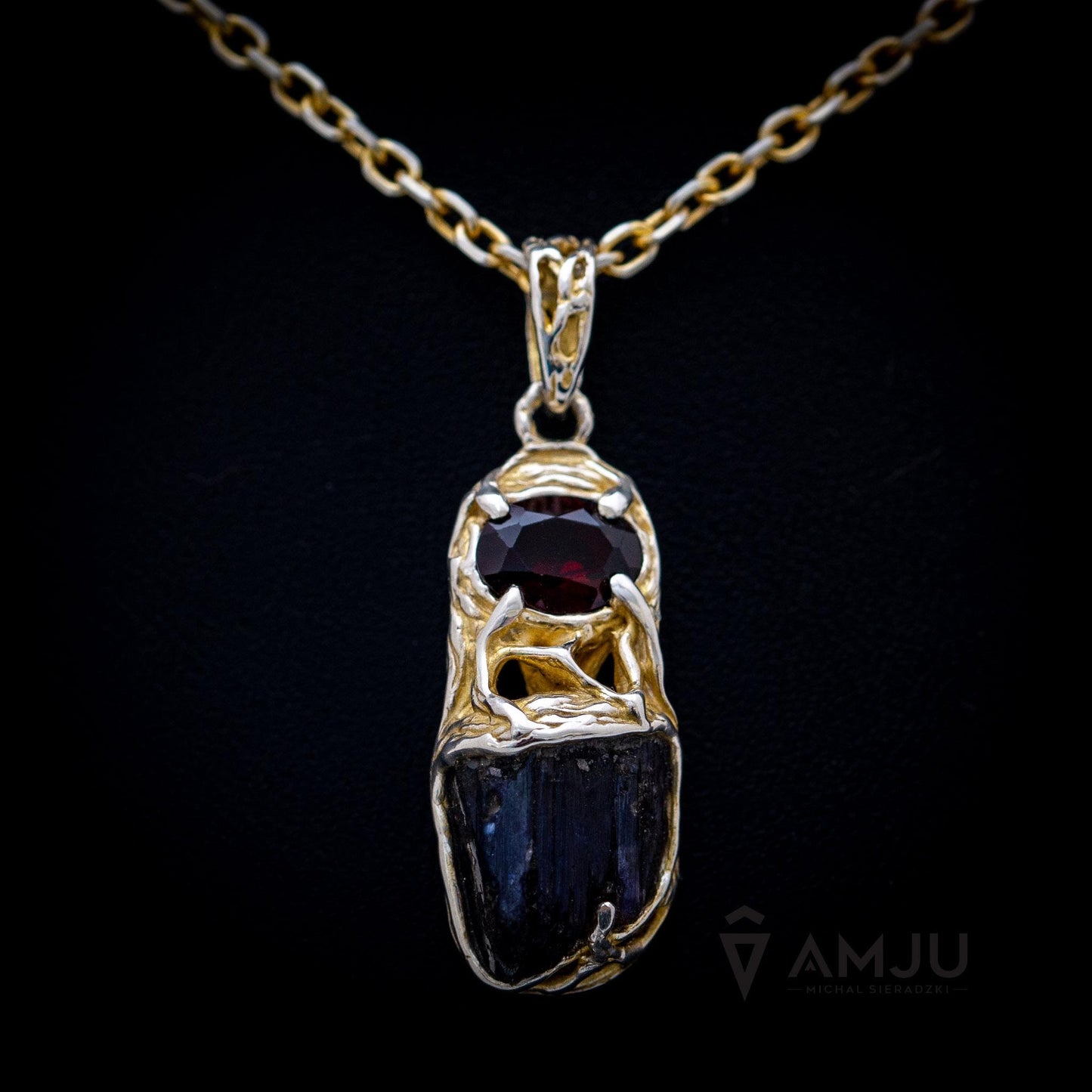 Raw Tanzanite crystal with oval cut Garnet