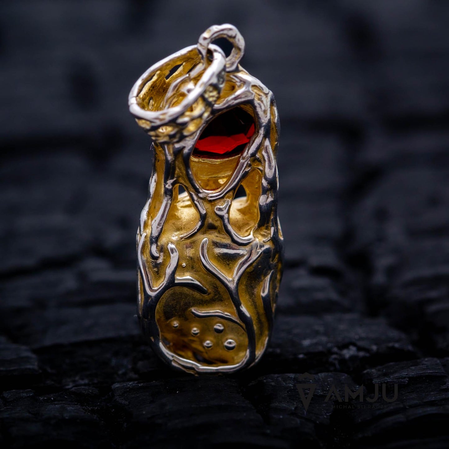 Raw Tanzanite crystal with oval cut Garnet