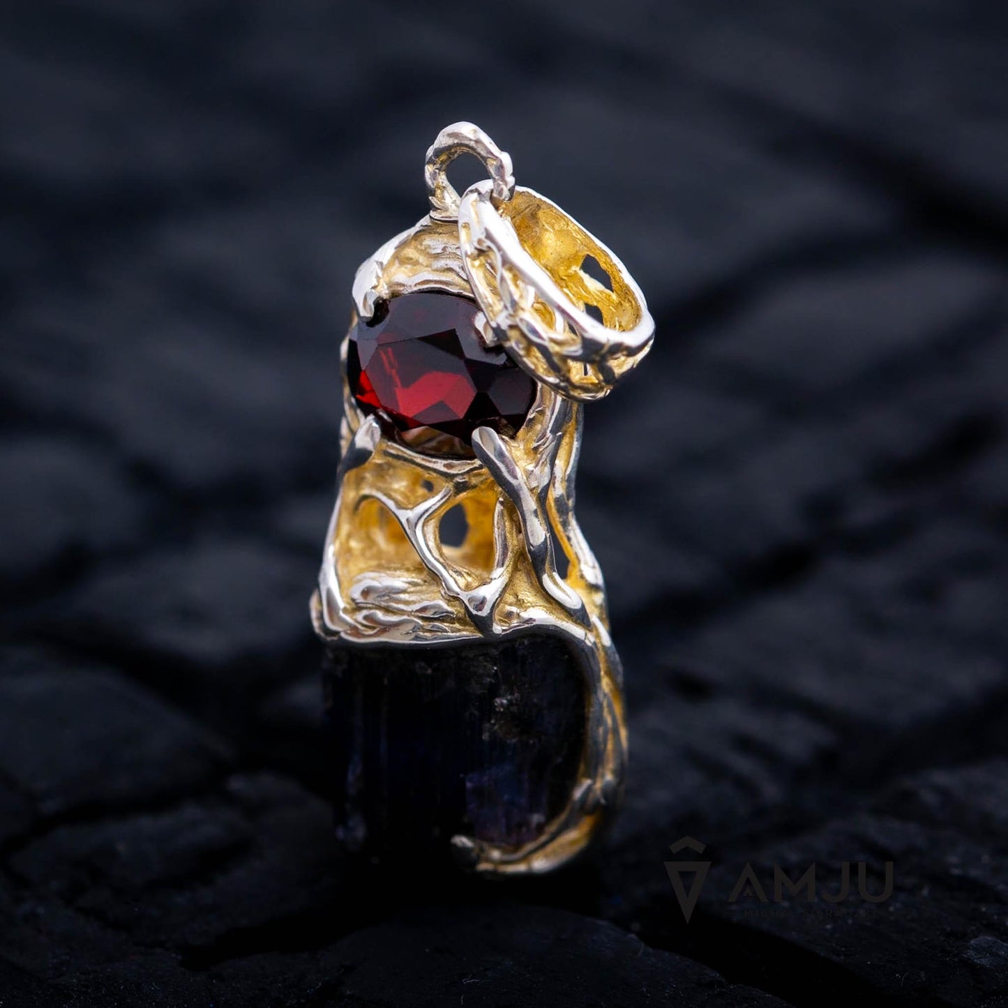 Raw Tanzanite crystal with oval cut Garnet